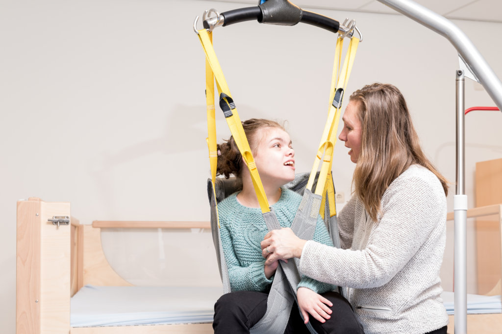 Disabled,Child,Together,With,A,Special,Needs,Carer,/,Working